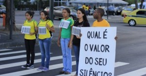 Brazilian Salvation Army volunteers campaigning against human trafficking, within the context of the FIFA World Cup. Portuguese text reads: 'What is the value of your silence?' (Credit: Photo courtesy of IHQ Flickr).  