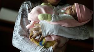 Provisional government figures indicated that last year 684 girls between the ages of 10 and 14 gave birth.  Paraguayan girl under age holding her baby. BBC Latin America